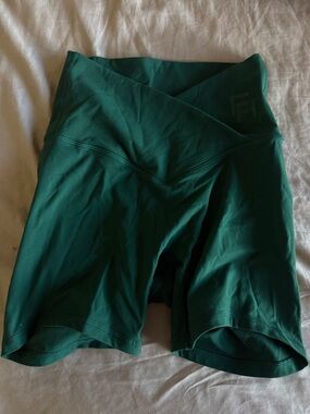 Deep green high-waisted wrap shorts